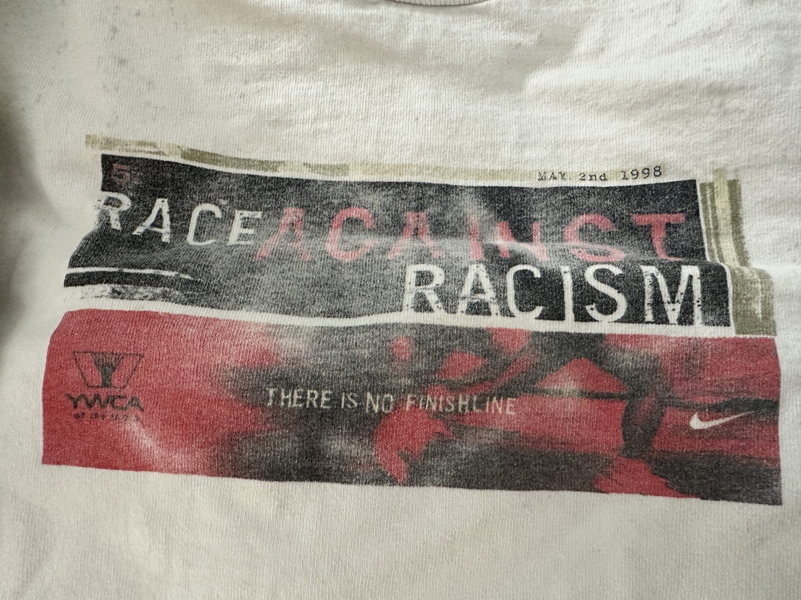 Photo of a T Shirt with the words 'Race Against Racism'